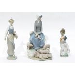 A Lladro figure of a girl carrying a basket of tulips,