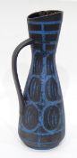 An Austrian pottery ewer decorated with geometric pattern in grey and blue,