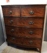 An early 19th century mahogany bowfronted chest with two short and three long graduated drawers,