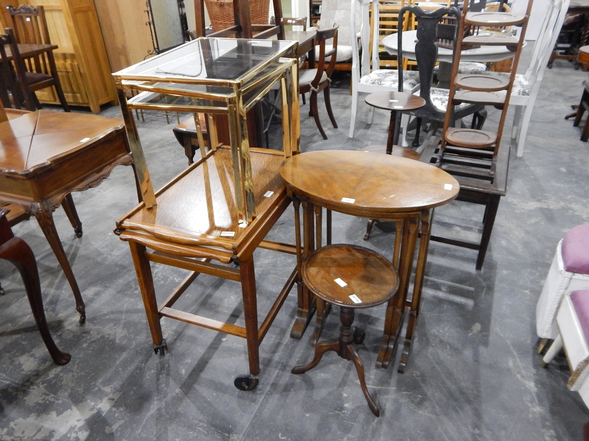 A quarter-veneered walnut nest of three tables, a wine table,