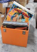 A brown canvas and wood school trunk, two vintage leather suitcases,