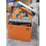 A brown canvas and wood school trunk, two vintage leather suitcases,