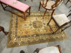 A Chinese wool rug with cream and green ground, geometric pattern,