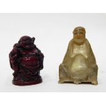 An Oriental carved jade seated figure of a sage,