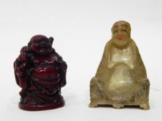 An Oriental carved jade seated figure of a sage,