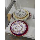 Two Aynsley plates decorated with fruits within burgundy borders and further decorative plates