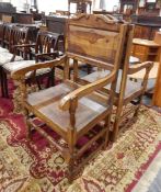 A pair of craft made walnut(?) open arm elbow chairs with solid seat and turned stretchers (2)