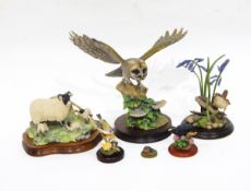 A Border Fine Arts model of a barn owl about to take flight, on wooden base, 29cm high,