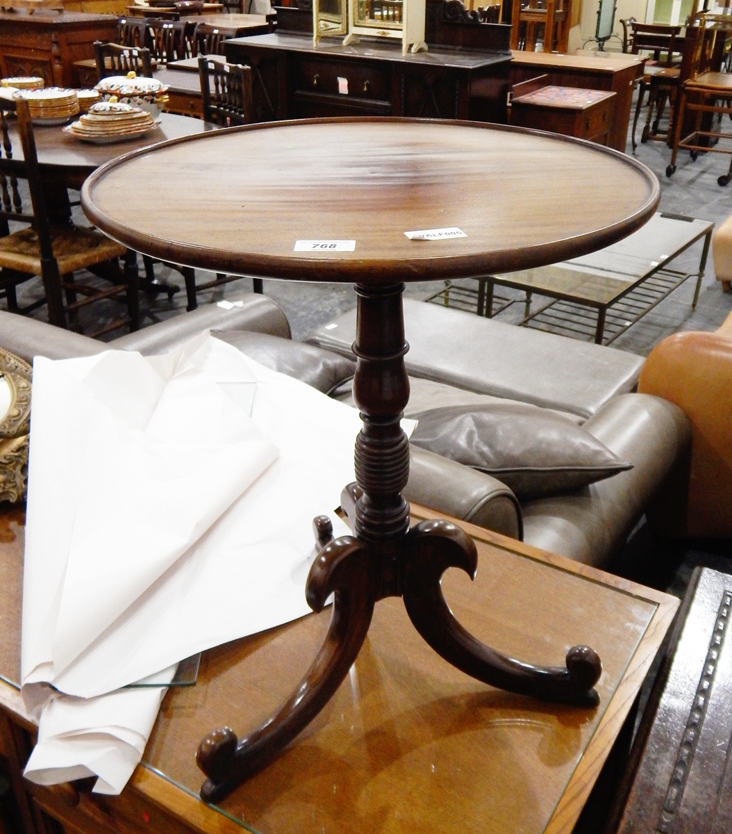 A nineteenth century circular top tripod table with dished border, on turned pedestal,