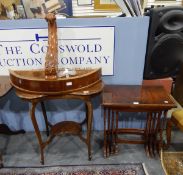 An early 20th century kidney-shaped two-tier occasional table on shaped supports,