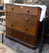 An oak chest of two short and three long drawers, with plinth base with canted corners,