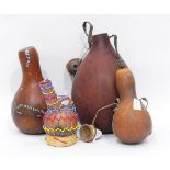 A quantity of African gourd vessels, vases, instruments and similar,