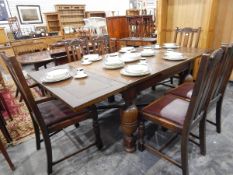 A circa 1930's oak draw-leaf dining table on stout bulbous turned supports and with X-stretchers