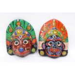 A pair of painted papier mache masks, African carved wood figures, lacquer bowls, baskets, etc.