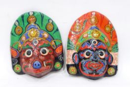 A pair of painted papier mache masks, African carved wood figures, lacquer bowls, baskets, etc.