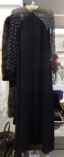 A 1930's full length black crepe evening dress with gauze shoulders and sleeves,