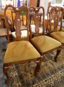 Four modern reproduction oak armchairs with green baize cushions,