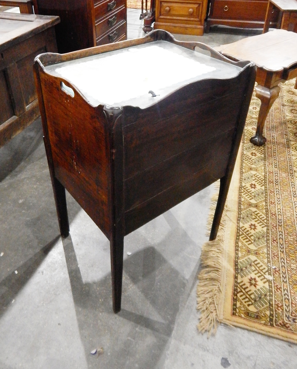 A Georgian mahogany converted tray top commode, the cupboard with tambour sliding front,