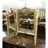 A triptych dressing mirror with bevel plated mirrors