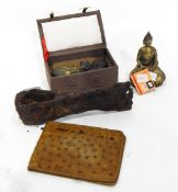 A metal axe head, a bronze seated figure of Buddha,