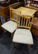 A modern pine square table with two matching chairs (3)