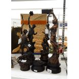 Four bronzed effect spelter figures of maidens depicting Enlightenment and Learning on turned