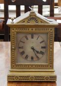 A gold painted mantel timepiece in architectural style case and a pair of slate and gilt metal