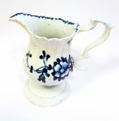 An 18th century blue and white pedestal cream jug, possibly Liverpool,