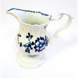 An 18th century blue and white pedestal cream jug, possibly Liverpool,