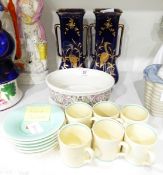 A set of six Susie Cooper coffee cans and saucers of plain cream and green design,