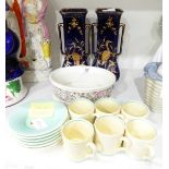 A set of six Susie Cooper coffee cans and saucers of plain cream and green design,