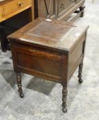 A stained as mahogany commode on turned bobbin supports