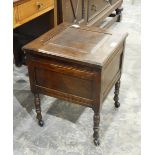 A stained as mahogany commode on turned bobbin supports