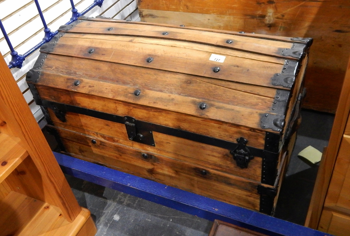 A pine trunk with domed top, wooden splat and button decoration,