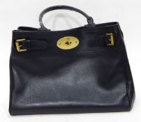 A Mulberry black leather handbag with buckle detail, the interior fitted with a zip pocket, approx.