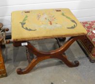 A 19th century mahogany X frame stool, the rectangular top with woolwork tapestry,