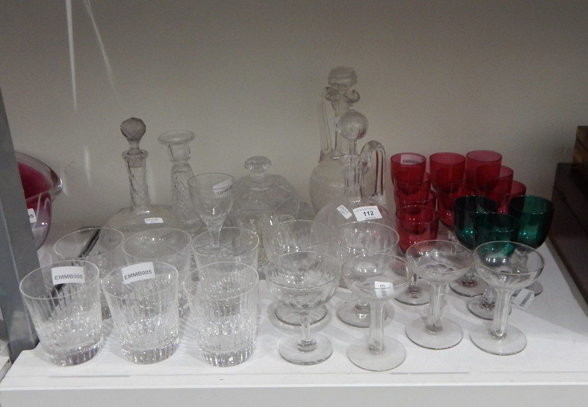 A set of six cut glass tumblers, two cut glass wine jugs and stoppers,