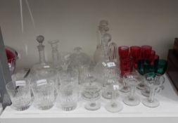 A set of six cut glass tumblers, two cut glass wine jugs and stoppers,