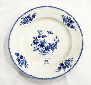 An 18th century porcelain plate in underglaze blue, flowering branch and insect,