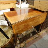 A late Regency mahogany Pembroke table fitted a drawer to frieze with lion mask and ring handles