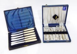 A cased set of silver plated dessert spoons and forks,