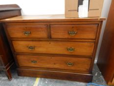 An oak chest of two short and two long graduated drawers,