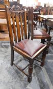 A set of six oak framed slat back dining chairs viz:- four standards and two carvers