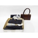 A Bally black patent leather clutch bag with bow decoration,