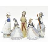 A Lladro figure of a girl with a broomstick, a Lladro figure of a girl in a brown dress with hat,