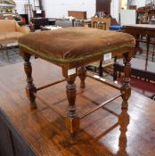 A stained beech stool with padded seat,