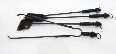 A set of four steel fire irons comprising shovel, tongs,