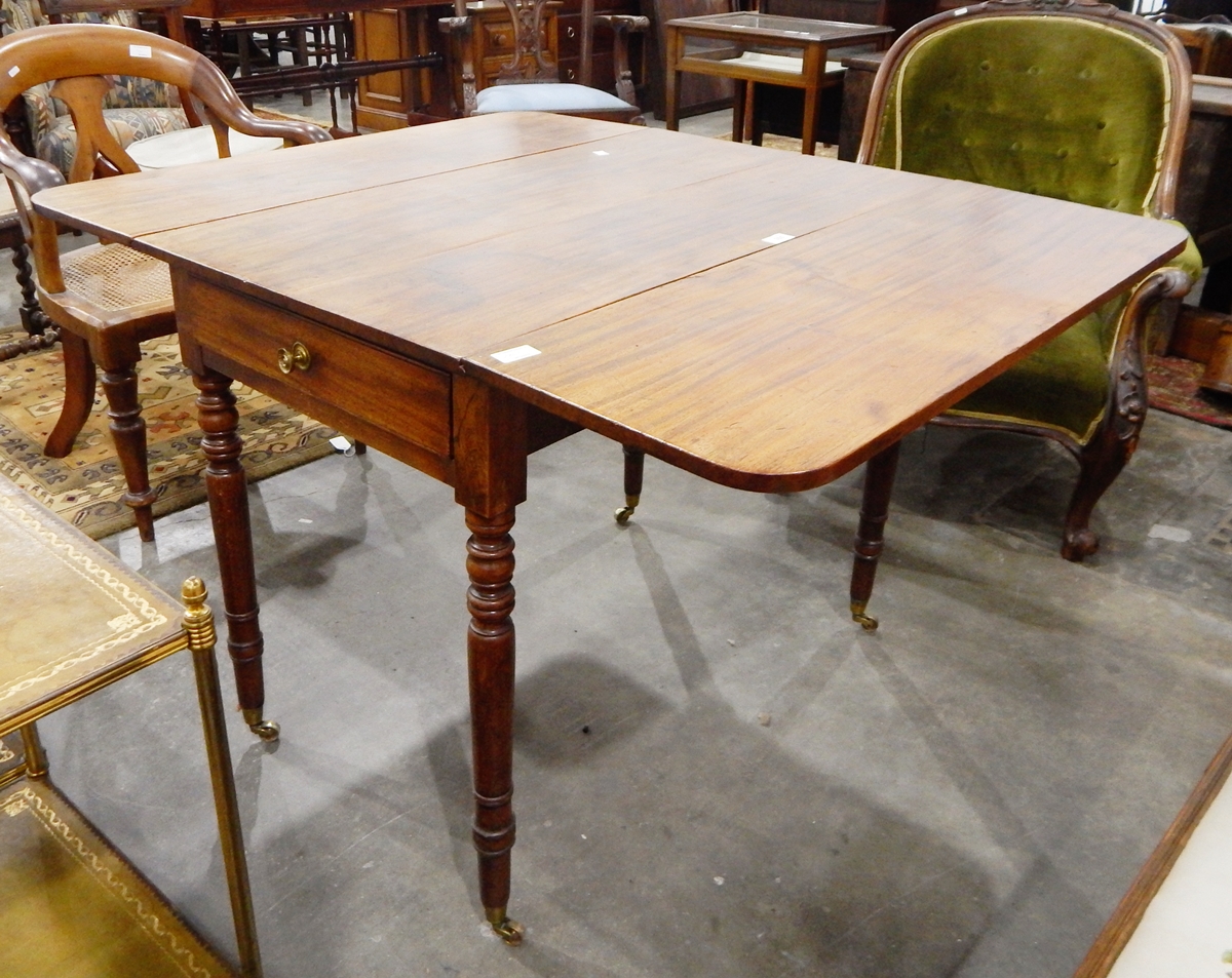 A mid 19th century mahogany Pembroke table fitted one drawer and one dummy drawer to frieze,