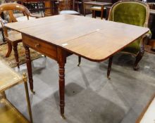 A mid 19th century mahogany Pembroke table fitted one drawer and one dummy drawer to frieze,