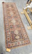 A Persian style runner with grey and red ground, cream borders, geometric pattern,